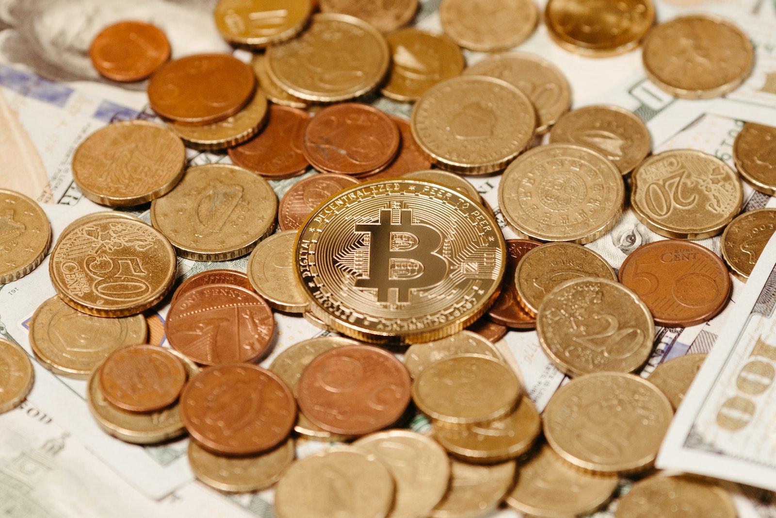 Bitcoin on Pile of Golden Coins